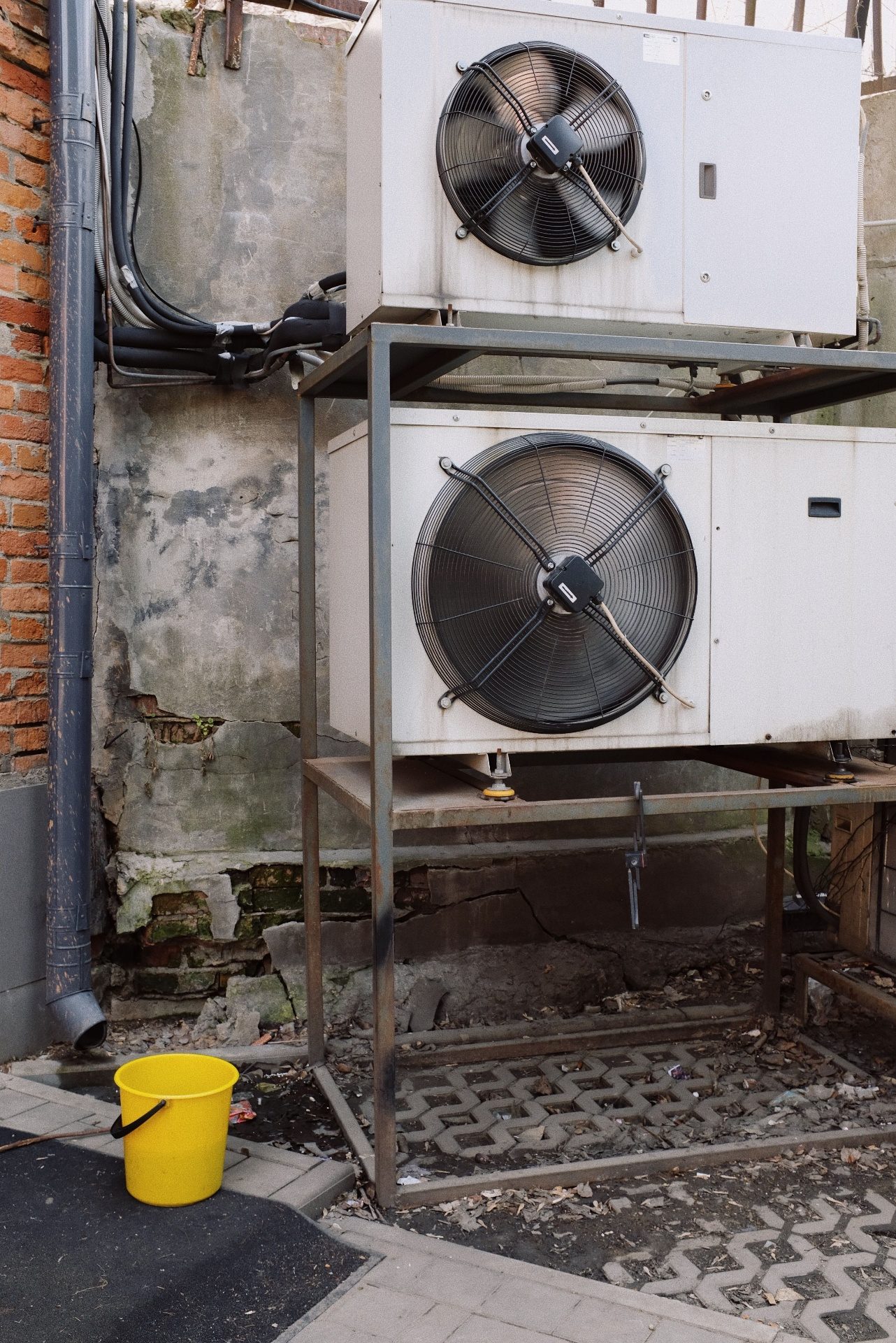 NorthAir HVAC technician next to a modern AC unit